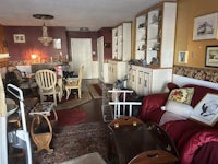 a room with a lot of furniture hanging from the ceiling