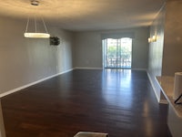 a room with a wooden ceiling and a lamp